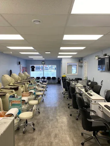Inside Yes B'y Nails with pedicure chairs and manicure stations